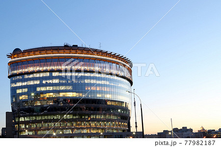 modern office building with big windows at night, in windows light shines. Moscow, Russia 77982187