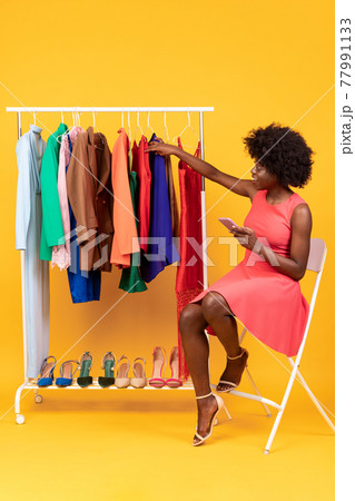 Happy Black Shopaholic Woman Using Smartphone For Online Shopping, Studio Happy Black Shopaholic Woman Using Smartphone For Online Shopping, Studio 77991133