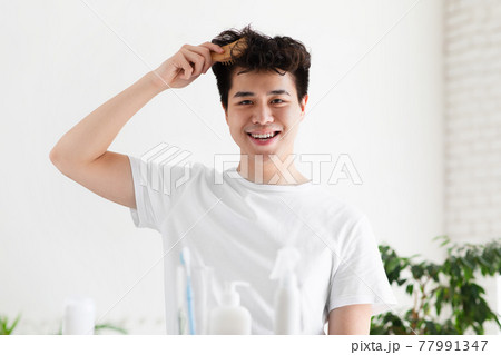 Stylish hairstyle, healthy hair, daily routine at home during covid lockdown Stylish hairstyle, healthy hair, daily routine at home during covid lockdown 77991347