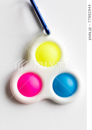 Simple Dimple Fidget toy, colorful anti-stress game isolated on white background 77992944