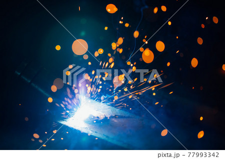 artistic welding sparks light, industrial background 77993342