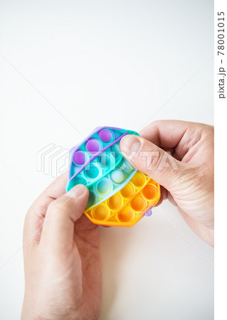 The most fashionable sensory toy. Popular fashion silicone colorful anti-stress hexagonal pop it toy. Someone presses on a silicone toy. A trendy toy for children. The most fashionable sensory toy. Popular fashion silicone colorful anti-stress hexagonal pop it toy. Someone presses on a silicone toy. A trendy toy for children. 78001015