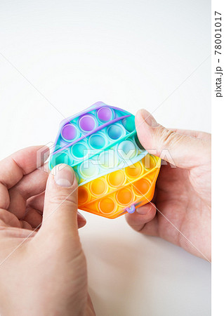 The most fashionable sensory toy. New popular colorful anti-stress toy pop it in the shape of a hexagon in hand. Fidget toy Rainbow Pop. The most fashionable sensory toy. New popular colorful anti-stress toy pop it in the shape of a hexagon in hand. Fidget toy Rainbow Pop. 78001017