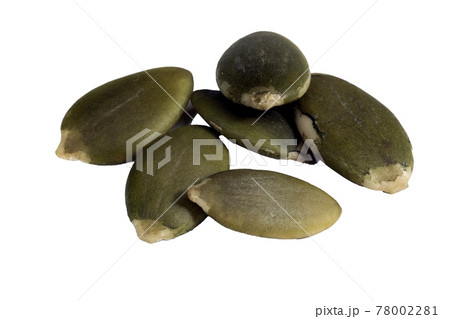 Peeled pumpkin seeds close-up macro isolated on white background. 78002281