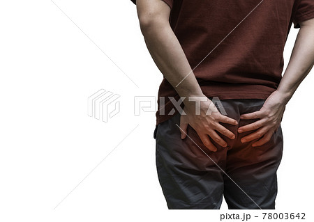 Close upmMan suffering from hemorrhoids, anal pain. painful spot highlighted in red. Close upmMan suffering from hemorrhoids, anal pain. painful spot highlighted in red. 78003642