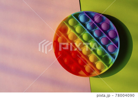 Trendy anti stress pop it toy flat lay with copy space. Trendy anti stress pop it toy flat lay with copy space. 78004090