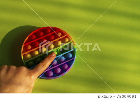 Trendy anti stress pop it toy flat lay with copy space. Trendy anti stress pop it toy flat lay with copy space. 78004091