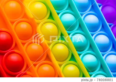Close-up Pop It texture colorful rainbow background, anti-stress Fidget toy 78008801