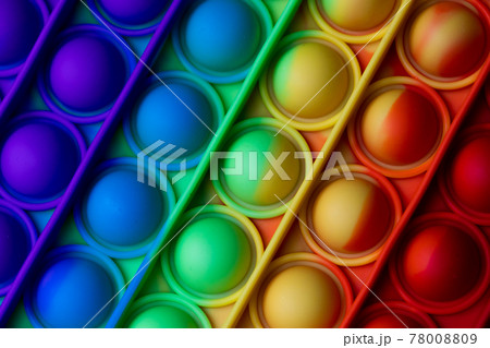 Close-up Pop It texture colorful rainbow background, anti-stress Fidget toy 78008809