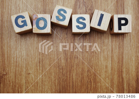 gossip word alphabet letter on wooden background 78013486