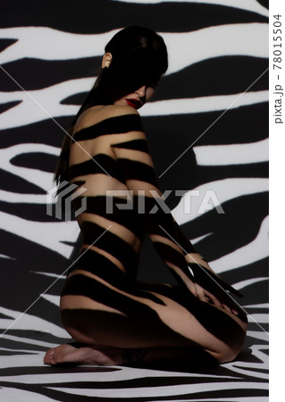Surrealist art portrait of young lady with shadow on her body 78015504