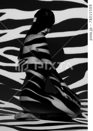 Surrealist art portrait of young lady with shadow on her body 78015509