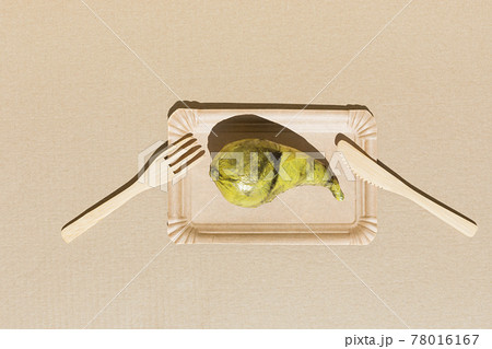 Pear wrapped plastic. Immature, tasteless or inedible food concept. Pear wrapped plastic. Immature, tasteless or inedible food concept. 78016167