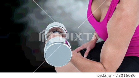 Composition of midsection of strong caucasian woman lifting dumbbells with clouds in background Composition of midsection of strong caucasian woman lifting dumbbells with clouds in background 78016636