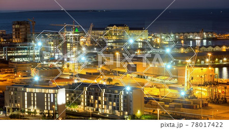 Composition of network of connections with hexagons over cityscape at night Composition of network of connections with hexagons over cityscape at night 78017422