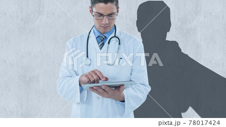 Composition of male doctor using tablet and male athlete shadow with copy space on white Composition of male doctor using tablet and male athlete shadow with copy space on white 78017424