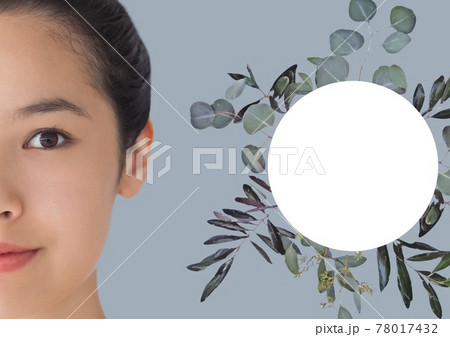 Composition of smiling asian woman with circular copy space and leaves on grey background Composition of smiling asian woman with circular copy space and leaves on grey background 78017432