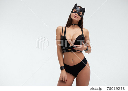 Sexy woman in black mask and lingerie in studio Sexy woman in black mask and lingerie in studio 78019258