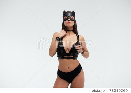 Sexy woman in black mask and lingerie in studio Sexy woman in black mask and lingerie in studio 78019260
