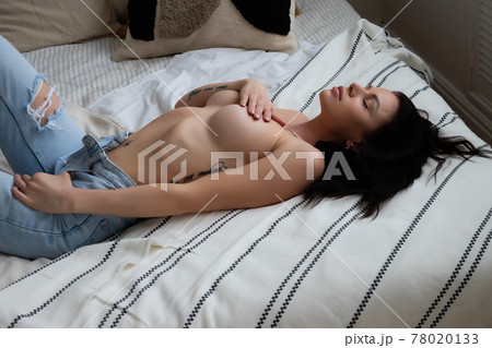 Sexy naked woman lying on back in thongs Sexy naked woman lying on back in thongs 78020133