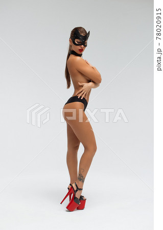 Sexy topless woman in black mask 78020915