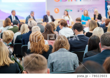 Speakers discussing business problems in auditorium Speakers discussing business problems in auditorium 78022603