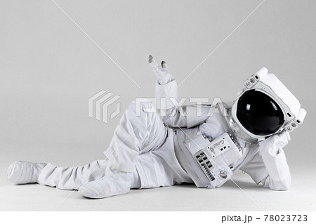 Astronaut lying on side, white background 78023723
