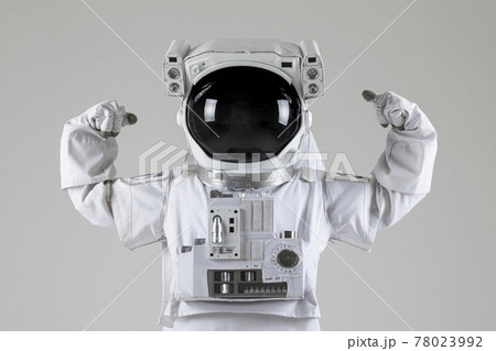 astronaut displaying muscles,white background 78023992