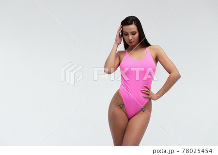 Slim woman in swimwear with sunglasses 78025454