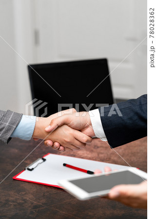 Corporate Businessmen Handshake Indoors.Two People Professionally Well Dressed Gesturing Togetherness.Working Colleague Partners Sign Deal In Agreement To Contract Corporate Businessmen Handshake Indoors.Two People Professionally Well Dressed Gesturing Togetherness.Working Colleague Partners Sign Deal In Agreement To Contract 78028362