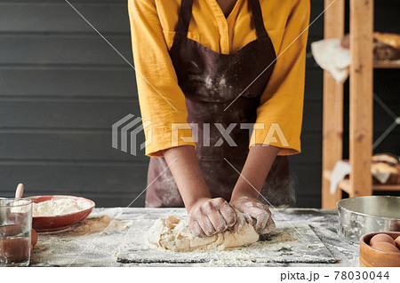 Baker kneading the dough Baker kneading the dough 78030044