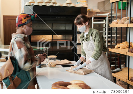 People in the bakery shop People in the bakery shop 78030194