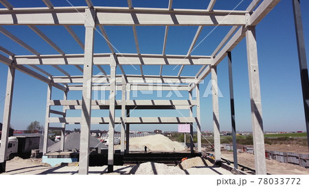 Concrete Building Construction Industrial Site. Reinforced Concrete Frame Of An Industrial Building. Camera Flight On A Construction Site. Beams With Steel Reinforcement From Above. Construction 78033772