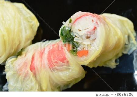 steamed Chinese cabbage stiffed glass noodles and carrot with crab stick on plate dipping sukiyaki sauce in cup eat couple Chinese jade noodles steamed Chinese cabbage stiffed glass noodles and carrot with crab stick on plate dipping sukiyaki sauce in cup eat couple Chinese jade noodles 78036206