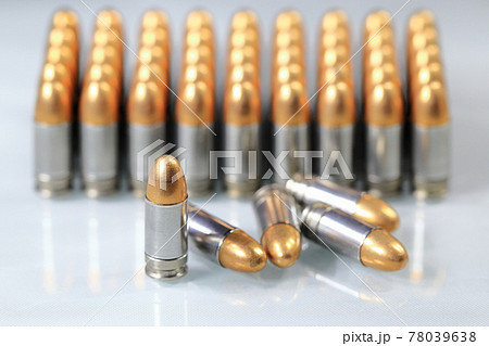 pack of bullet 9mm parabellum FMJ (Full Metal Jacket ) on reflection surface with shallow focus. 78039638