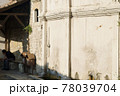 Old street fountain with a copper bowl Tas and carved flower on the wall in Safranbolu. UNESCO site. Turkey. 78039704