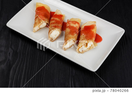 Pancakes stuffed with cream 78040266