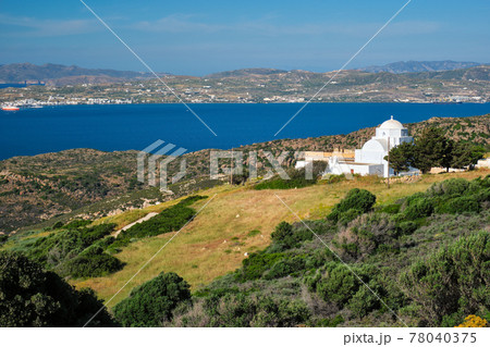 View of Milos island and Greek Orthodox traditional whitewashed church in Greece View of Milos island and Greek Orthodox traditional whitewashed church in Greece 78040375