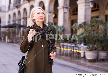 Portrait of an elegant elderly woman on spring street of european city 78040433