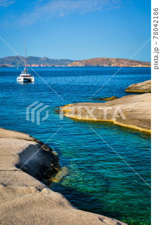 Yacht boat at Sarakiniko Beach in Aegean sea, Milos island , Greece 78042186