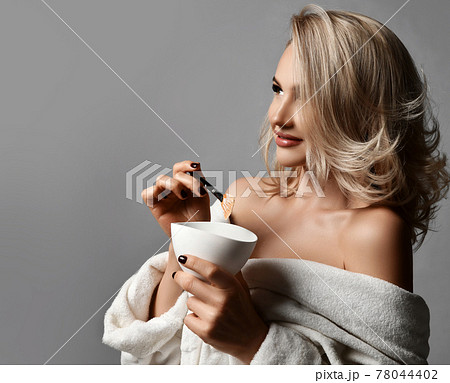 Gorgeous rich blonde woman with healthy silky skin Gorgeous rich blonde woman with healthy silky skin 78044402
