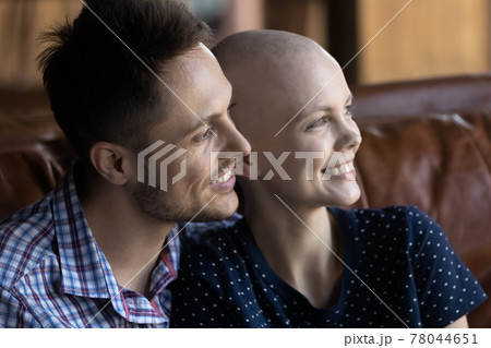 Happy young married couple going through oncology disease Happy young married couple going through oncology disease 78044651