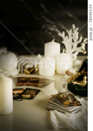 Defocused mystic ritual with tarot cards, fortune telling and esoteric symbols.  78046534