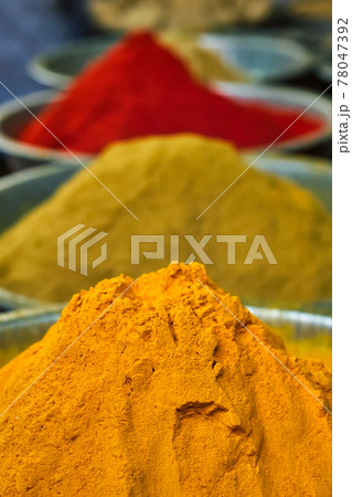 Turmeric curcuma powder and chili powder in spices market in India Turmeric curcuma powder and chili powder in spices market in India 78047392