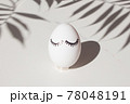 Frame of Easter decorated eggs with eyes, on a white marble background. Minimal easter concept. Top view 78048191