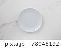 Empty ceramics plate isolated on white marble background. Copy space. Menu Recipe Concept 78048192