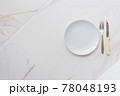Empty ceramics plate isolated on white marble background. Copy space. Menu Recipe Concept 78048193