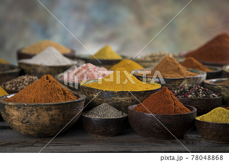 Spices on wooden bowl background 78048868