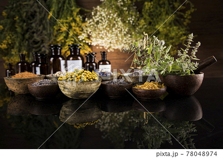 Black mirror background, Natural remedy, healing herbs Black mirror background, Natural remedy, healing herbs 78048974
