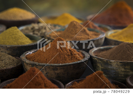Spices and herbs selection on wooden background Spices and herbs selection on wooden background 78049229